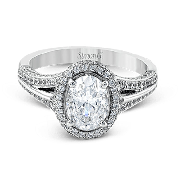 This lovely 18k white gold engagement ring design is created for an elegant oval center stone and features .77 ctw of white diamonds accented by a small touch of .03 ctw of yellow diamonds.
