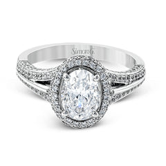 This lovely 18k white gold engagement ring design is created for an elegant oval center stone and features .77 ctw of white diamonds accented by a small touch of .03 ctw of yellow diamonds.