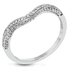 This lovely 18k white gold engagement ring design is created for an elegant oval center stone and features .77 ctw of white diamonds accented by a small touch of .03 ctw of yellow diamonds.