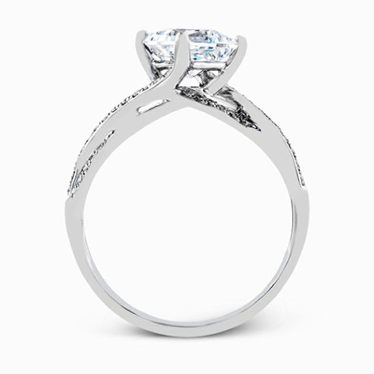 This dramatic white gold engagement ring and wedding band set are highlighted by .23 ctw of dazzling round cut white diamonds in a distinctive modern twist design.