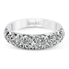 This lacy vintage inspired white gold band features .62 ctw of round cut white diamonds in a charming floral design.