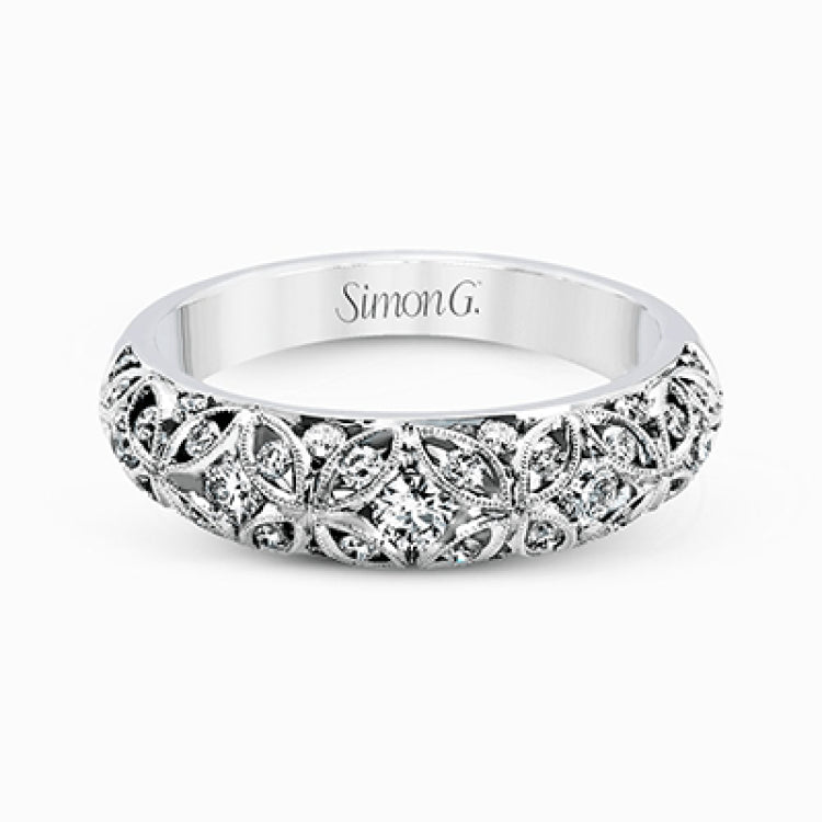 This lacy vintage inspired white gold band features .62 ctw of round cut white diamonds in a charming floral design.
