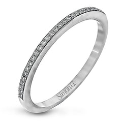 The elegant design of this classic white gold engagement ring and wedding band is complemented by .21 ctw of glimmering round cut white diamonds.