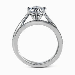 The elegant design of this classic white gold engagement ring and wedding band is complemented by .21 ctw of glimmering round cut white diamonds.