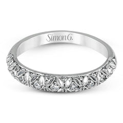 This intricate band has a floral, nature-inspired design and contains .32 ctw of white diamonds.