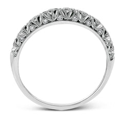 This intricate band has a floral, nature-inspired design and contains .32 ctw of white diamonds.