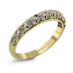This intricate band has a floral, nature-inspired design and contains .32 ctw of white diamonds.