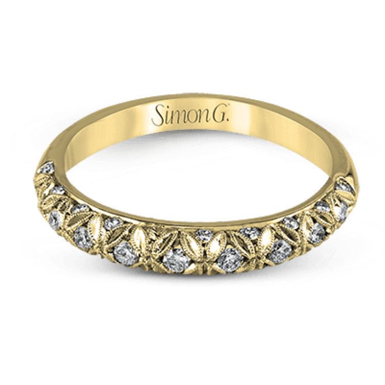 This intricate band has a floral, nature-inspired design and contains .32 ctw of white diamonds.