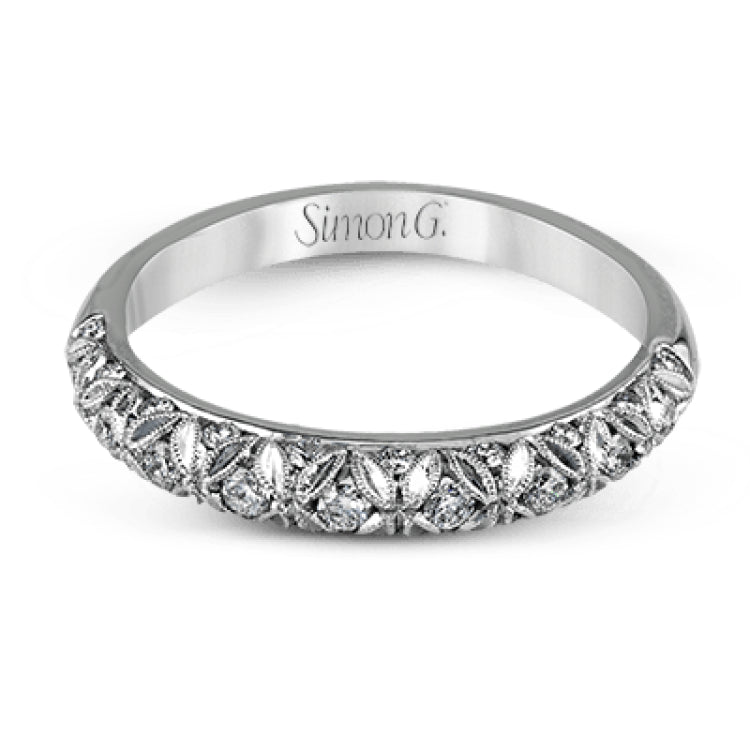 This intricate band has a floral, nature-inspired design and contains .32 ctw of white diamonds.