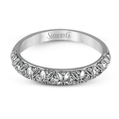 This intricate band has a floral, nature-inspired design and contains .32 ctw of white diamonds.