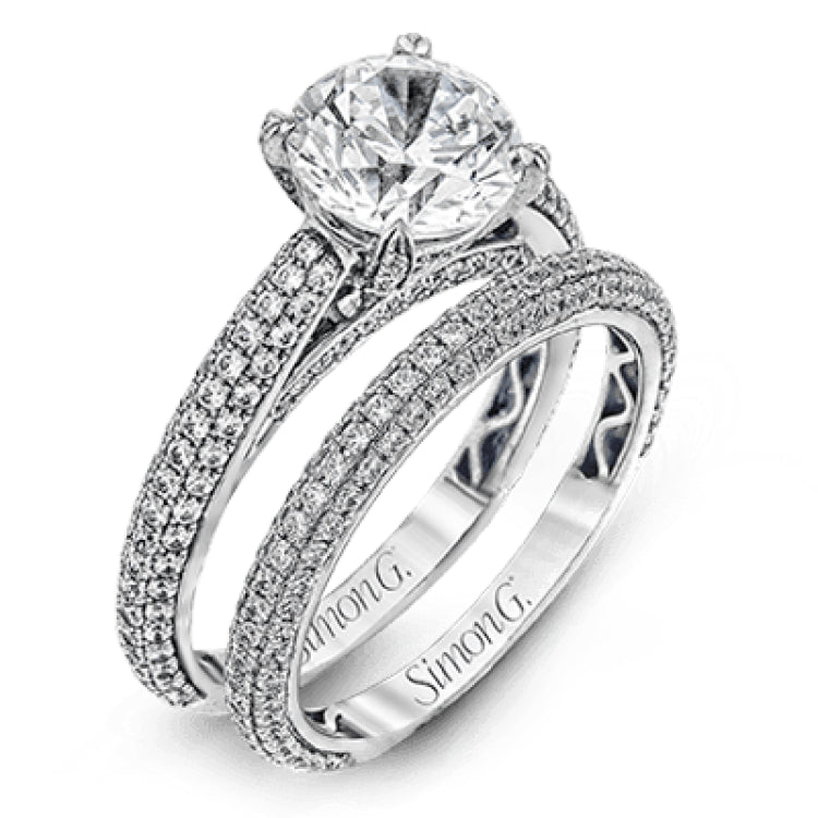 This classically styled white gold engagement ring is set with 1.30 ctw of shimmering white diamonds in a stunning design.