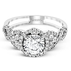 Reflecting an intricate modern design, this remarkable white gold ring is emphasized by a lovely halo complemented with .59 ctw round cut white diamonds.