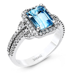This elegant white gold contemporary ring is set with an arresting 1.31 ctw center aquamarine highlighted by .42 ctw round cut white diamond accents.