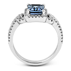 This elegant white gold contemporary ring is set with an arresting 1.31 ctw center aquamarine highlighted by .42 ctw round cut white diamond accents.