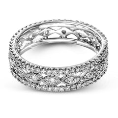 This wonderful 18k gold band features .87 ctw of white diamonds set into an intricate, three layer design.  It can be worn on its own as a fashion statement or function as a wedding band.