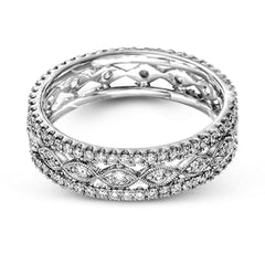 This wonderful 18k gold band features .87 ctw of white diamonds set into an intricate, three layer design.  It can be worn on its own as a fashion statement or function as a wedding band.