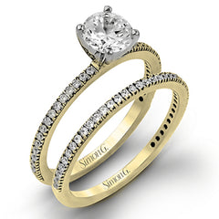 The classic, streamlined design of this 18k white gold wedding set is accented by .30 ctw of sparkling white round brilliant diamonds.