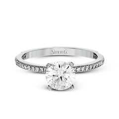 The classic, streamlined design of this 18k white gold wedding set is accented by .30 ctw of sparkling white round brilliant diamonds.