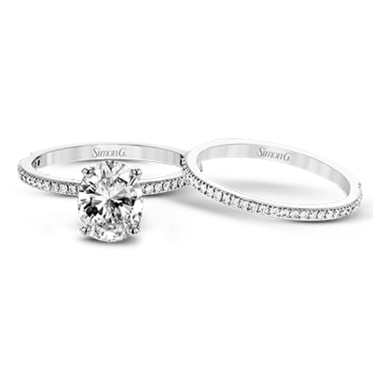 The classic, streamlined design of this 18k white gold wedding set is accented by .30 ctw of sparkling white round brilliant diamonds.