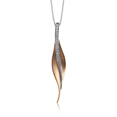 A sleek, svelte style highlights this modern leaf-like pendant, set with a column of .13 ctw of dazzling white diamonds.