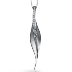 A sleek, svelte style highlights this modern leaf-like pendant, set with a column of .13 ctw of dazzling white diamonds.