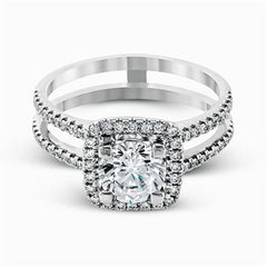 Featuring an eye-catching modern design, this white gold ring is accentuated with a dazzling .50 ctw round cut white diamonds.