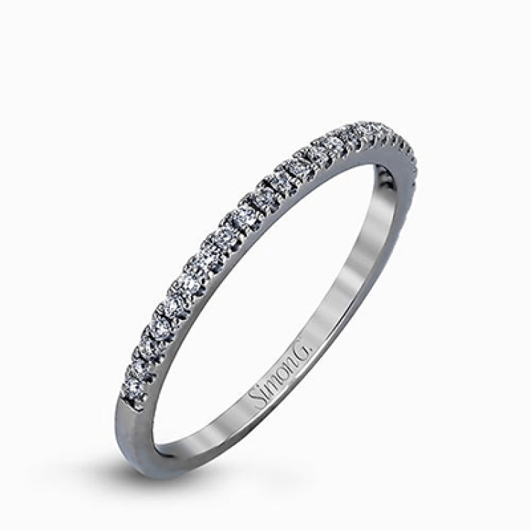 Featuring an eye-catching modern design, this white gold ring is accentuated with a dazzling .50 ctw round cut white diamonds.