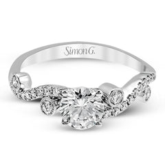 Playful and modern, this white gold wedding set sparkles with .31 ctw of round white diamonds highlighting the center stone.