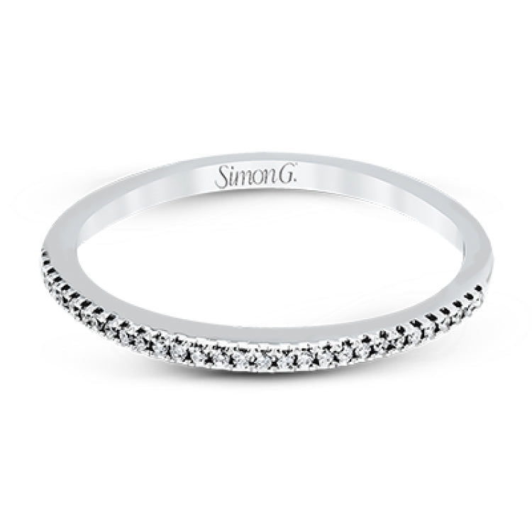 Playful and modern, this white gold wedding set sparkles with .31 ctw of round white diamonds highlighting the center stone.