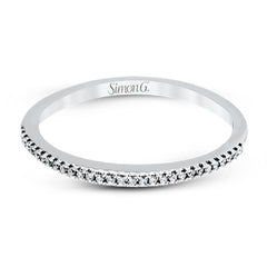 Playful and modern, this white gold wedding set sparkles with .31 ctw of round white diamonds highlighting the center stone.