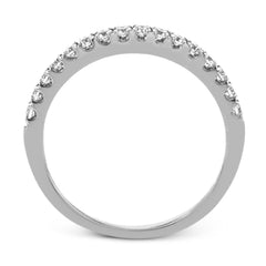 Playful and modern, this white gold wedding set sparkles with .31 ctw of round white diamonds highlighting the center stone.