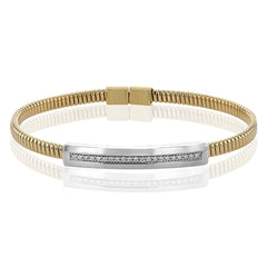 A perfect stacking bangle made of 18K yellow gold cable, adorned with a diamond plaque 0.23 ctw. and magnetic closure