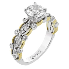 This 18K modern vintage engagement ring features a two-tone band with beaded wg bezel set diam 0.28 ctw, and high polish yg sections