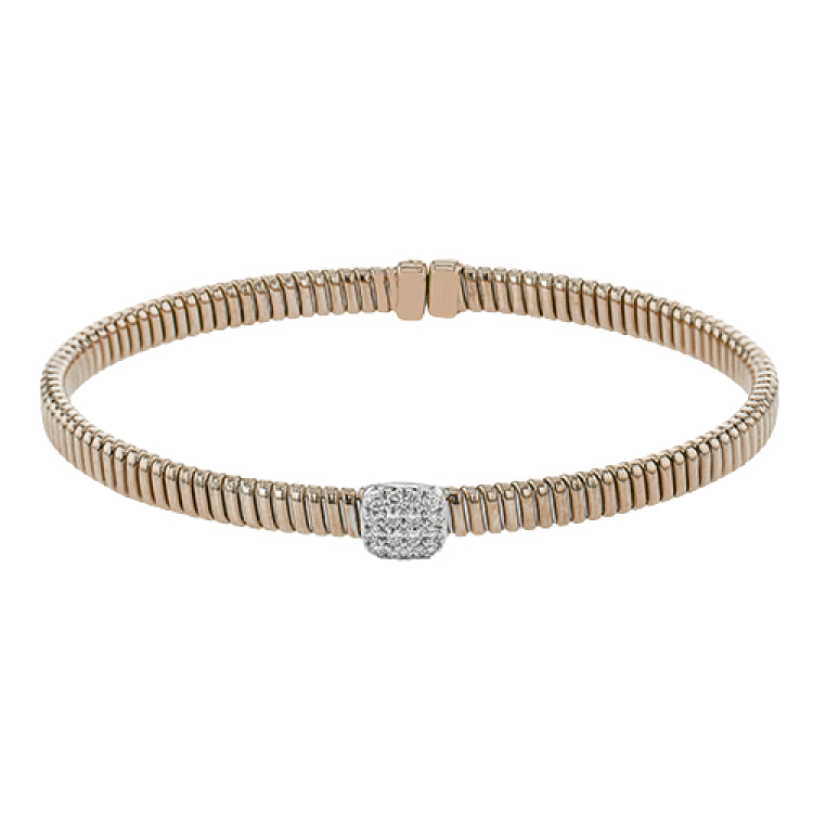 This modern design 18k rose gold textured bangle with .19ctw diamonds set in a cushion shape and magnetic closure, is perfect for stacking