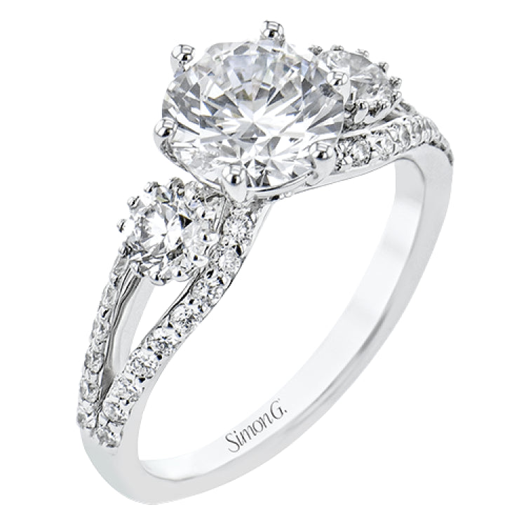 This 3 stone engagement ring has a split shank design and 2 side diamonds 1/4 ct each, totaling 0.48 ctw. and outlined with diamond accents of .35 ctw.