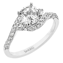 Contemporary 18 kt white gold engagement ring has a subtle knife edge and 2 diamonds of .21 ctw flanking the center, accented with a swirl of round diamonds .27 ctw