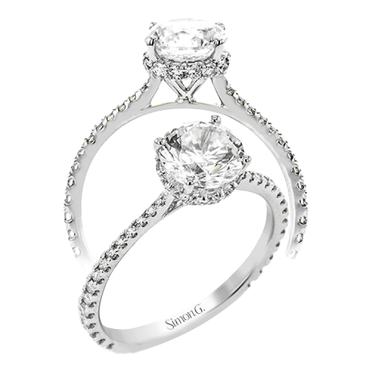 Part of our Underhalo Collection, this engagement ring contains the perfect touch of white diamonds that wink from underneath the center stone setting as well as down the sides of the ring.