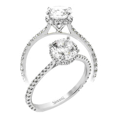 Part of our Underhalo Collection, this engagement ring contains the perfect touch of white diamonds that wink from underneath the center stone setting as well as down the sides of the ring.