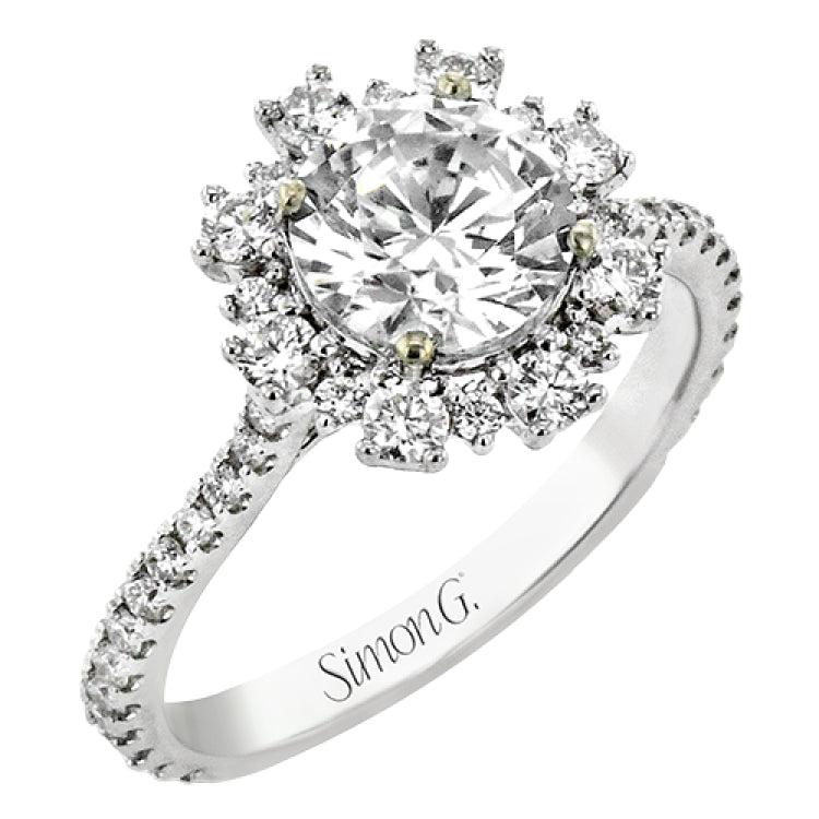 From our Super nova collection this 18K engagement ring is a unique take on the classic halo ring, and features 0.60 ctw of round diamonds