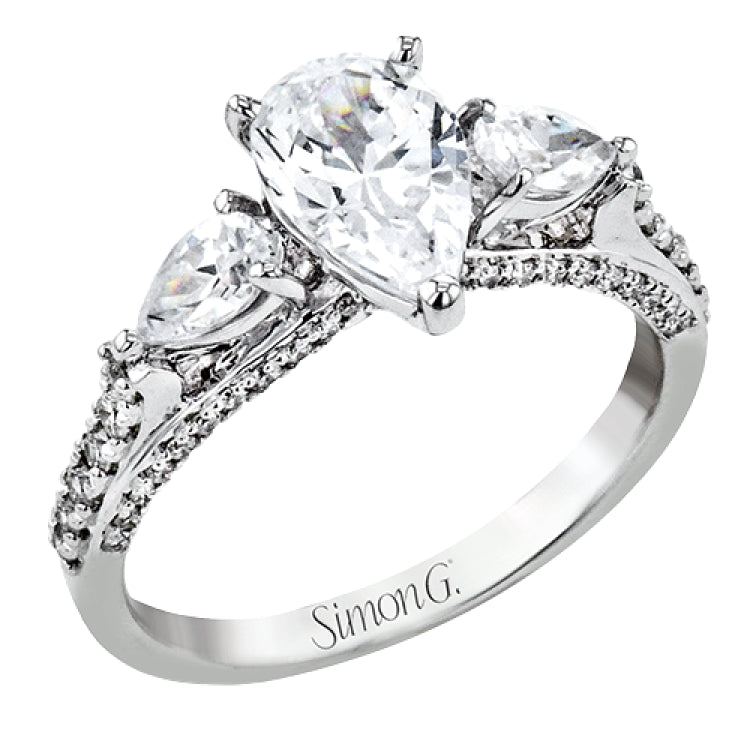 Pear shaped side stone set horizontally give this 18k white gold engagement ring a modern feel, accentuating the pear shape center stone.