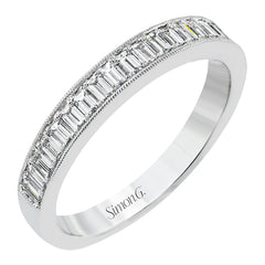 This sleek anniversary band features brilliant baguette cut diamonds 0.56 ctw., set with a delicate millgrain edge from our Simon set collection