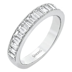 This gorgeous anniversary band is the perfect selection for those who seek a luxurious style to accompany any engagement ring, it features 1.06 cttw baguette diamonds with milgrain edges