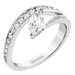 A marquise diamond set at an angle creates a contemporary look in this wonderful ring from our Lightning Collection.