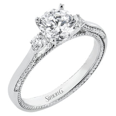 Diamond side stones, milgrain and diamond detailing on the sides of the ring add to the beauty of this unique engagement ring.