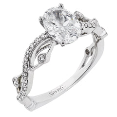 The intertwined design of this 18k gold engagement ring perfectly offsets an oval shaped center stone.