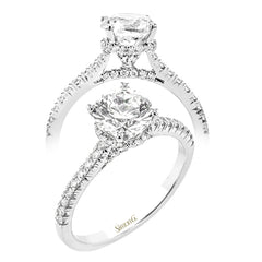 Featuring our new underhalo design, a ring of diamonds sits underneath the center stone in this bridal ring, giving a remarkable side view.