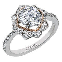 This detailed 18k white and rose gold ring design features .43 ctw of white diamonds.