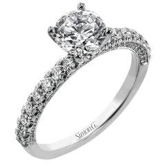 This engagement ring is sure to shine, with a classic straight design set with .49 ctw of white side diamonds.