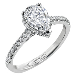 A hidden underhalo of brilliant diamonds reveals itself when this ring is turned to side, diamonds shining from every angle.