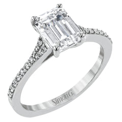 Simple yet stunning, this graceful engagement ring is made for an emerald cut center stone and is set with .16 ctw of white diamonds.